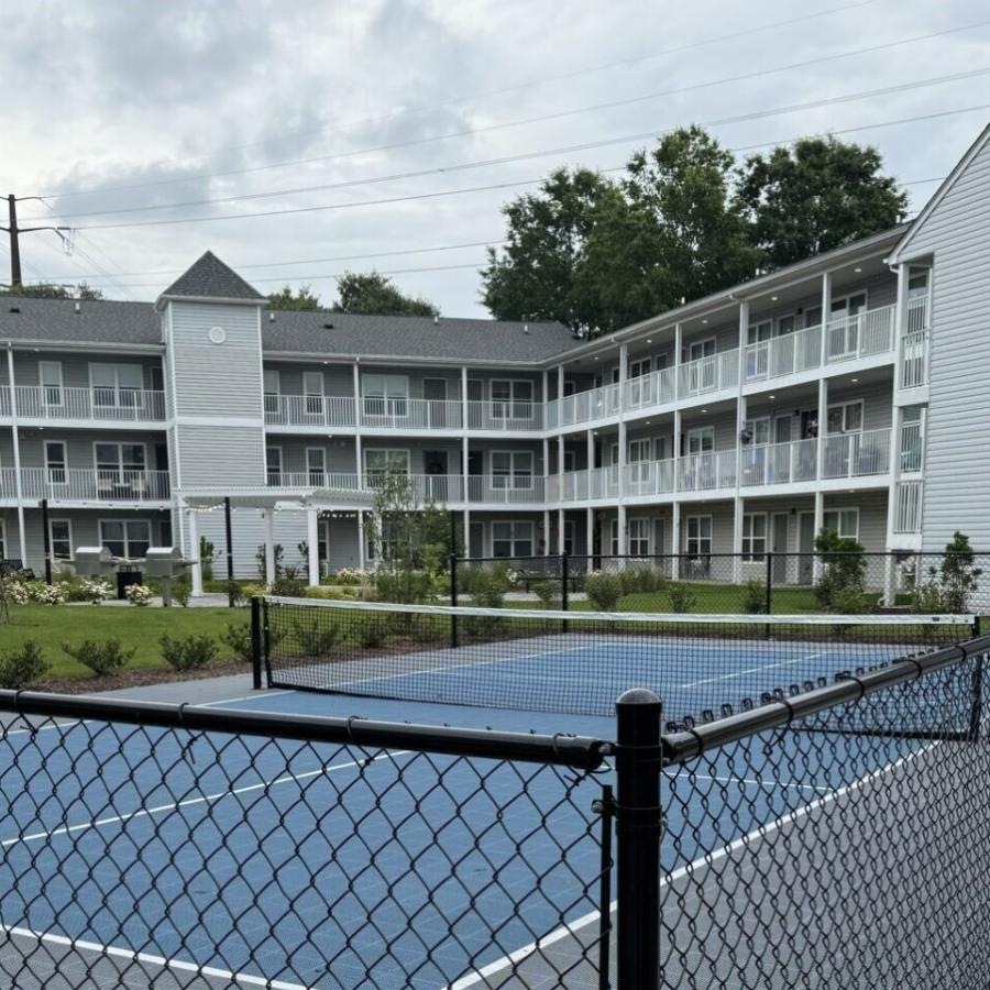 a courtyard with a tennis court